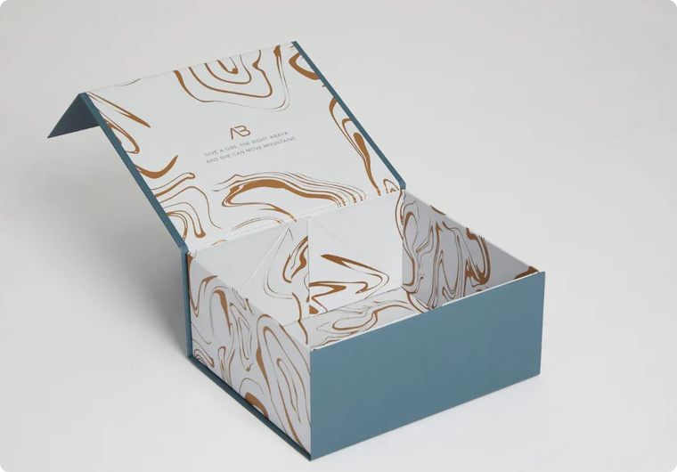 Open box with marbled design on a white background